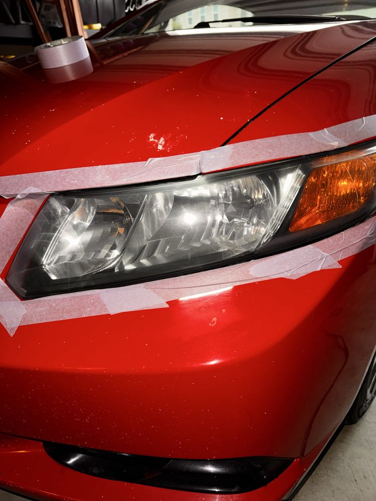 Red luxury car with gleaming exterior detail